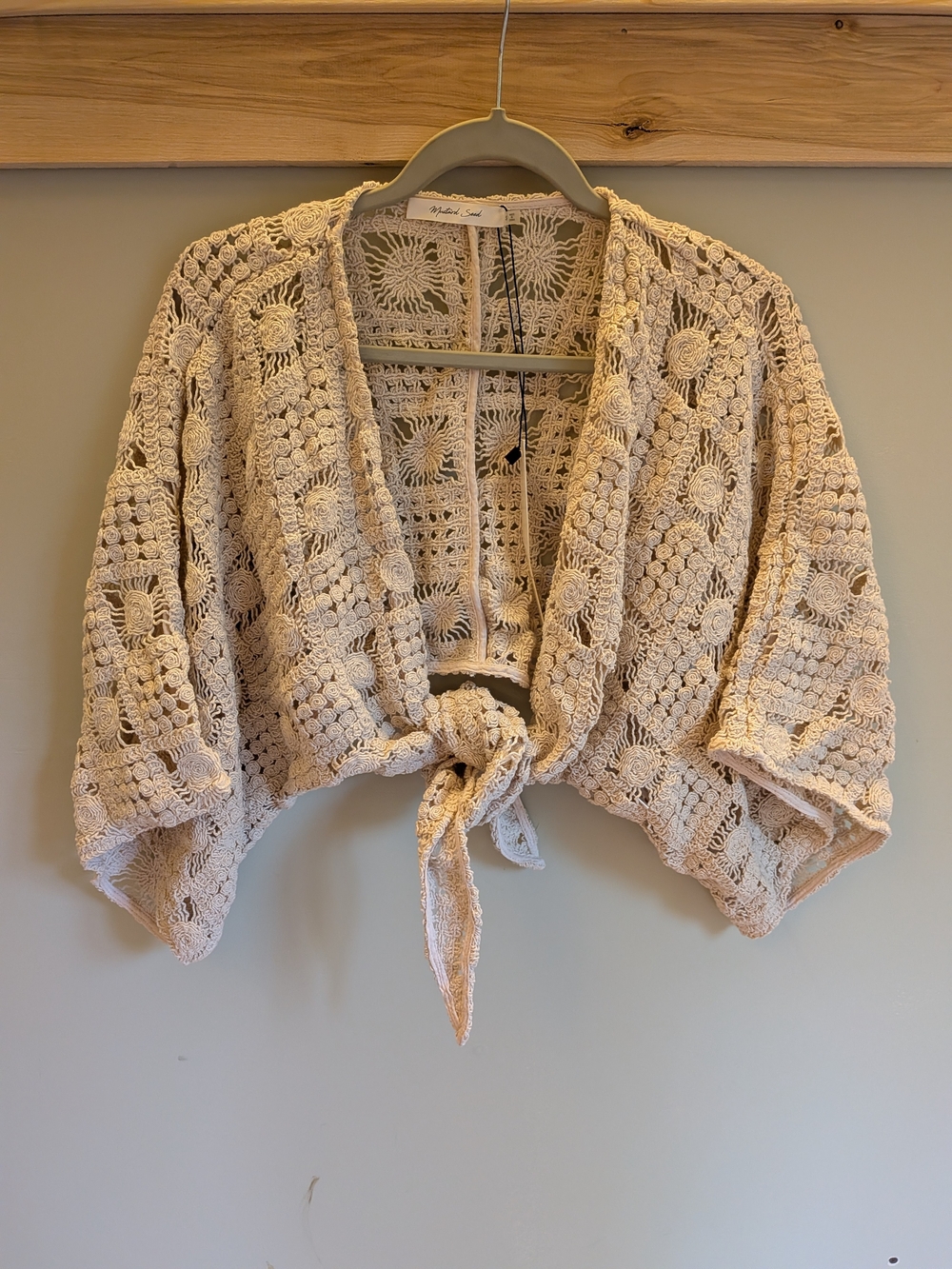 Mustard Seed Crochet Tie-Front Shrug in Creamy Beige